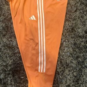 Adidas Orange Sweatpants with Signature Stripes
